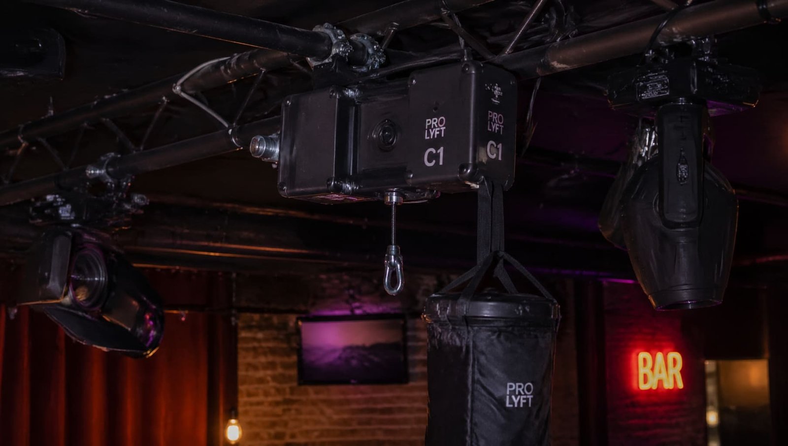 A C1 standard electric hoist used in a small bar setting for lighting rigs